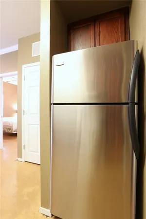 a white refrigerator freezer and a dishwasher sitting inside of a kitchen