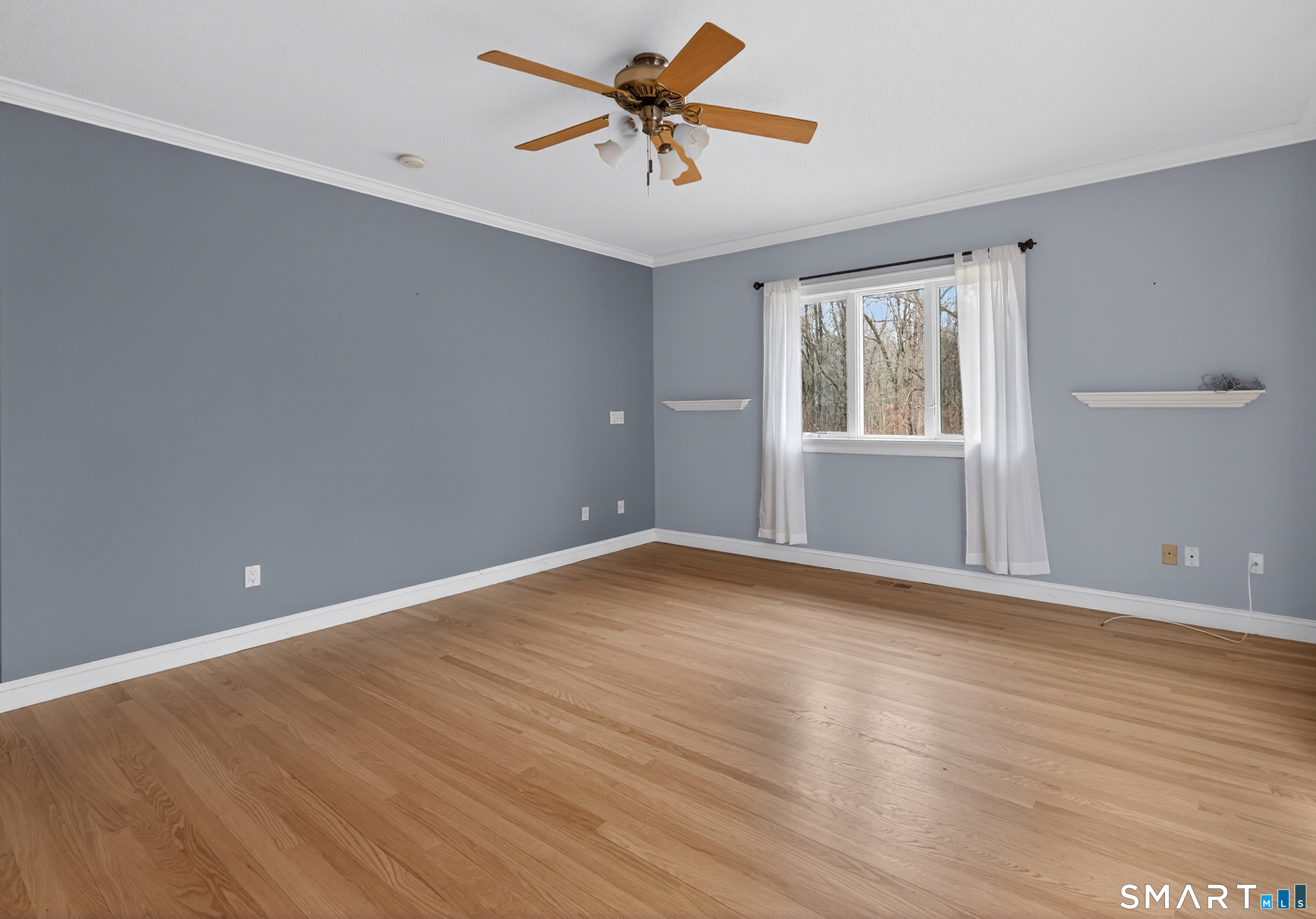 724 Strong Road South Windsor, CT 06074 - Photo 12 of 39 an empty room with wooden floor and windows