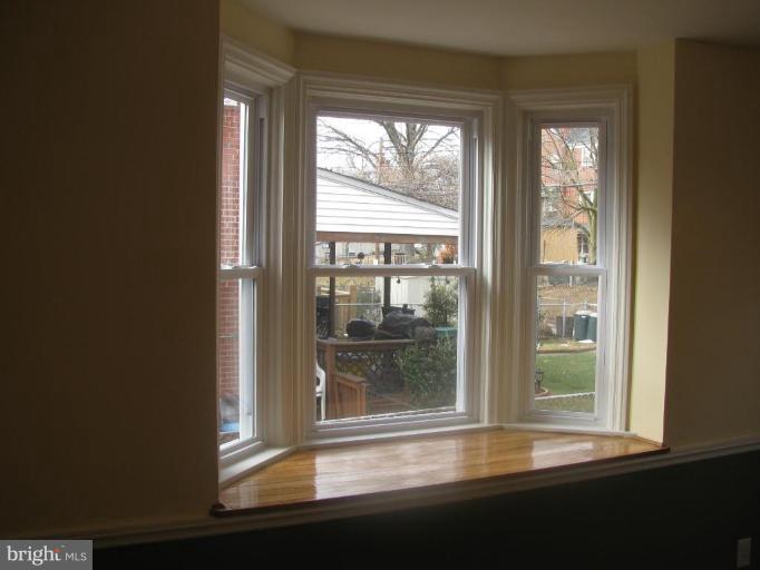 1614 Burnwood Road Baltimore, MD 21239 - Photo 7 of 11 a view of a room that has a large window