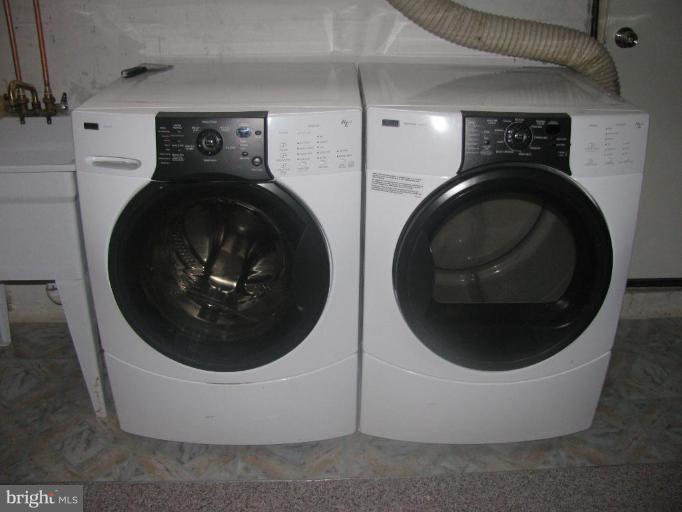 1614 Burnwood Road Baltimore, MD 21239 - Photo 9 of 11 a close up view of a washer and dryer