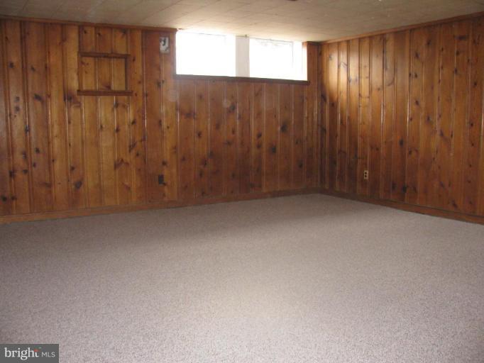 1614 Burnwood Road Baltimore, MD 21239 - Photo 10 of 11 a view of an empty room with a window