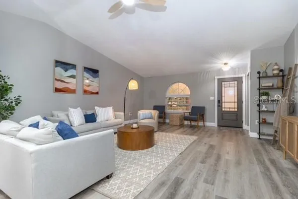 a living room with furniture and a fireplace