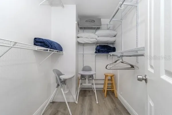 a bedroom with a large bed and window