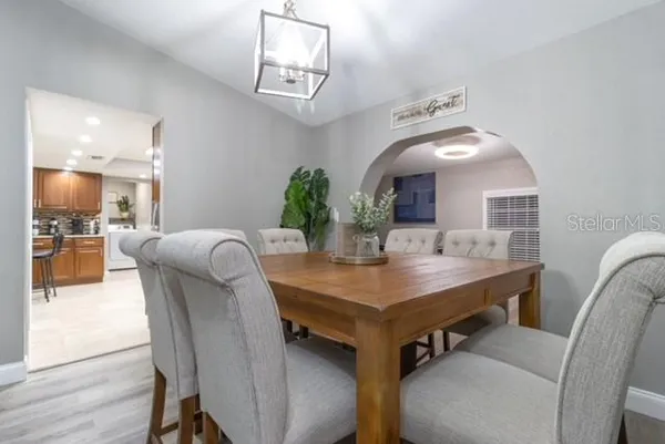 a kitchen with stainless steel appliances granite countertop wooden cabinets a sink and dishwasher