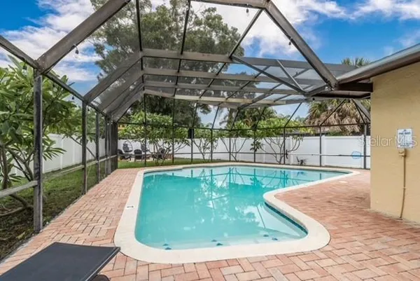 a view of a swimming pool with a patio