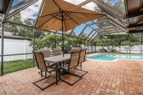 a view of a swimming pool with a patio