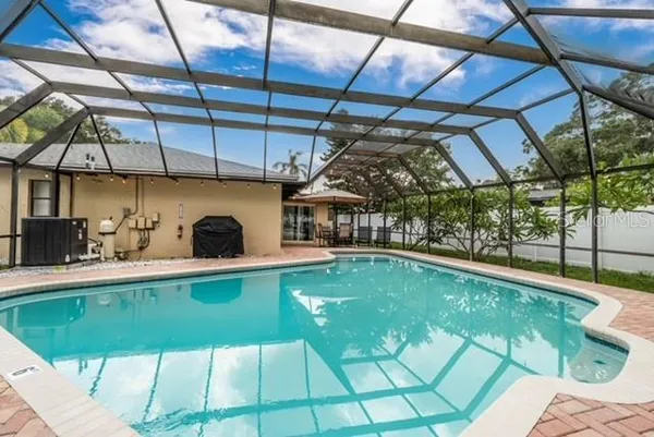a view of a swimming pool with a patio