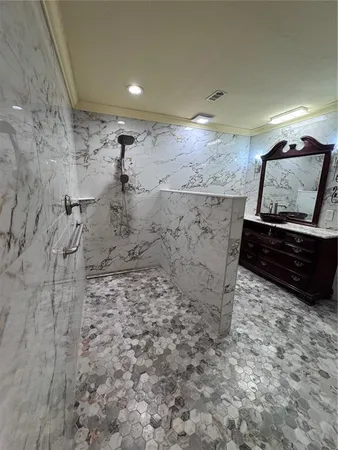 a bathroom with a sink a toilet and mirror