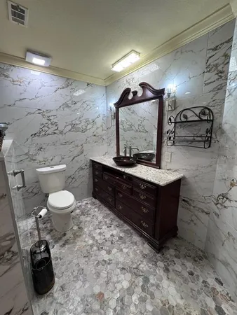 a view of a couches with wooden floor