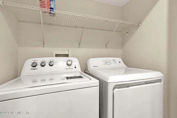 a utility room with dryer and washer