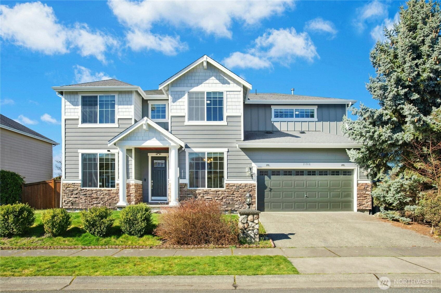 21918 40th Avenue Southeast Bothell, WA 98021 - Photo 1 of 1 a front view of a house with garden