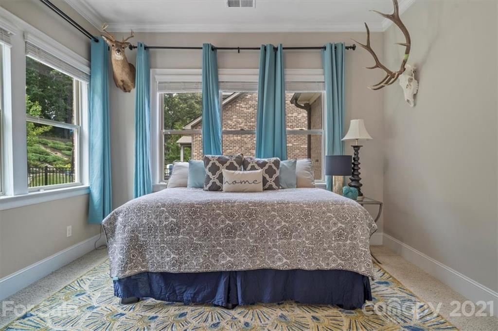1526 Afton Way Fort Mill, SC 29708 - Photo 12 of 48 a bed sitting in a bedroom next to a window