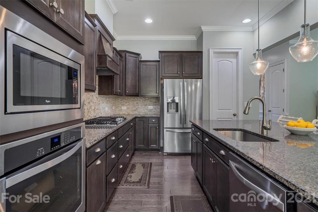 1526 Afton Way Fort Mill, SC 29708 - Photo 20 of 48 a kitchen with stainless steel appliances granite countertop a sink a stove and a refrigerator