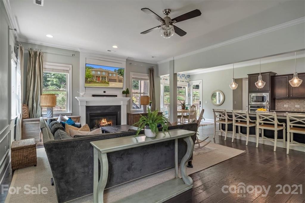 1526 Afton Way Fort Mill, SC 29708 - Photo 22 of 48 a living room with furniture a fireplace and a table