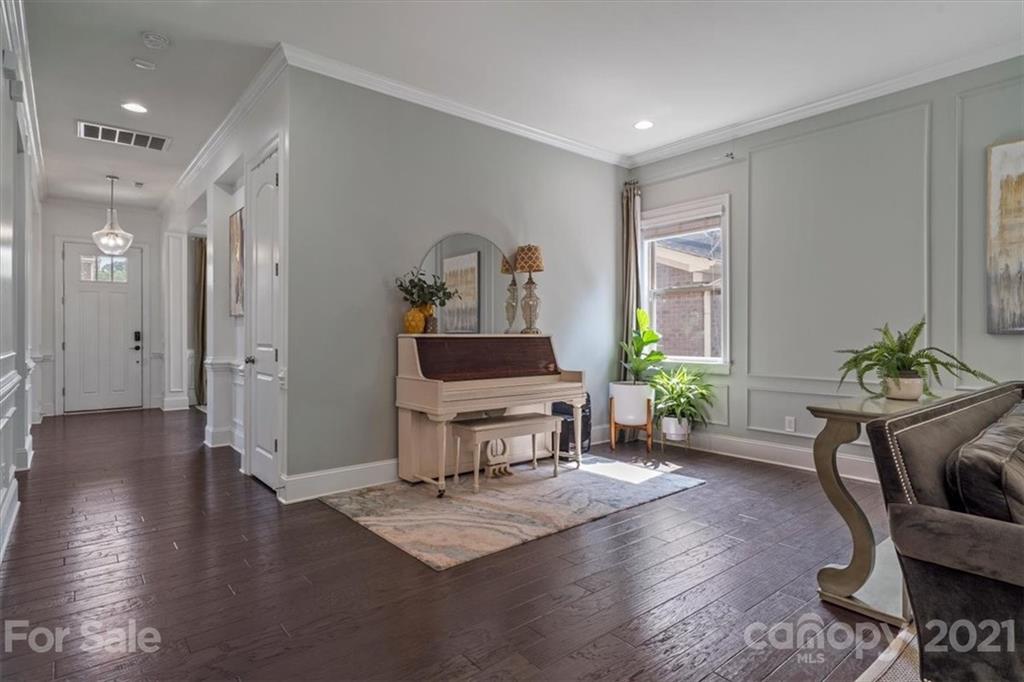 1526 Afton Way Fort Mill, SC 29708 - Photo 26 of 48 a living room with furniture a wooden floor and a potted plant