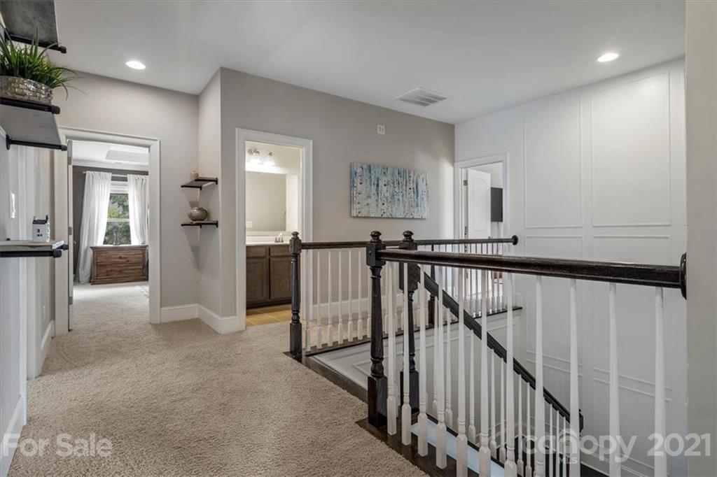 1526 Afton Way Fort Mill, SC 29708 - Photo 28 of 48 a view of a hallway with wooden floor and stairs