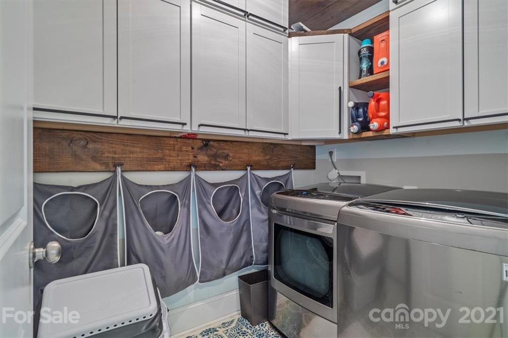 1526 Afton Way Fort Mill, SC 29708 - Photo 29 of 48 a utility room with stainless steel appliances granite countertop a stove and a microwave