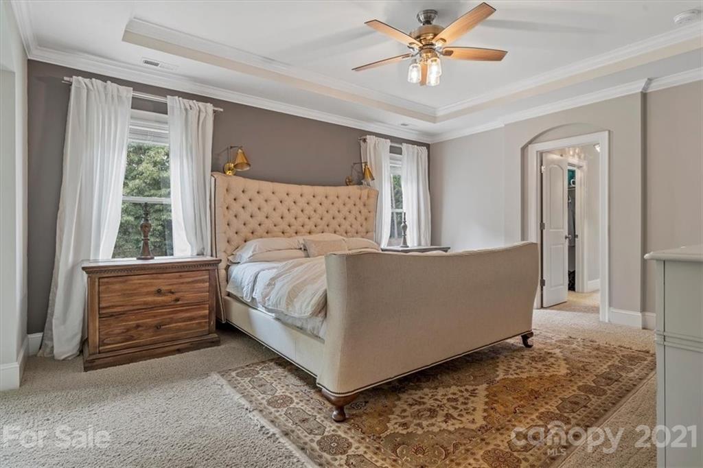 1526 Afton Way Fort Mill, SC 29708 - Photo 30 of 48 a bed sitting in a spacious bedroom next to a window
