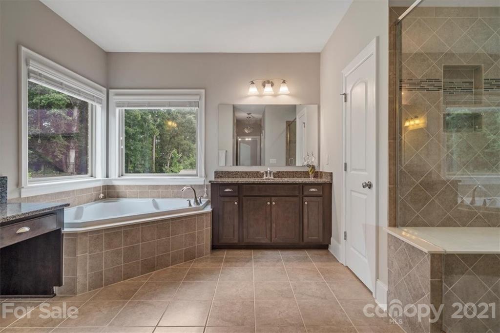 1526 Afton Way Fort Mill, SC 29708 - Photo 34 of 48 a bathroom with a tub sink and mirror