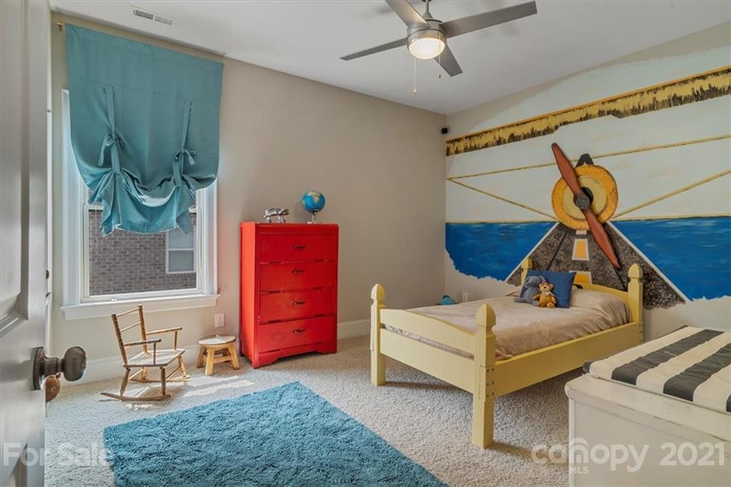 1526 Afton Way Fort Mill, SC 29708 - Photo 36 of 48 a bedroom with furniture and a chandelier