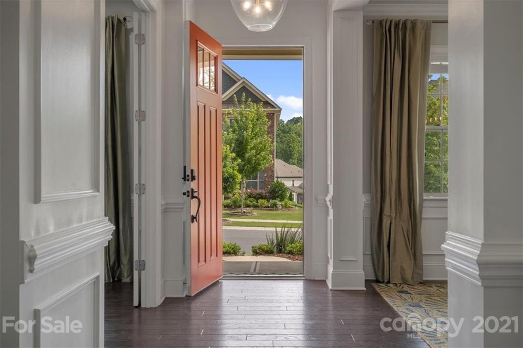 1526 Afton Way Fort Mill, SC 29708 - Photo 5 of 48 a view of a hallway with wooden floor and windows