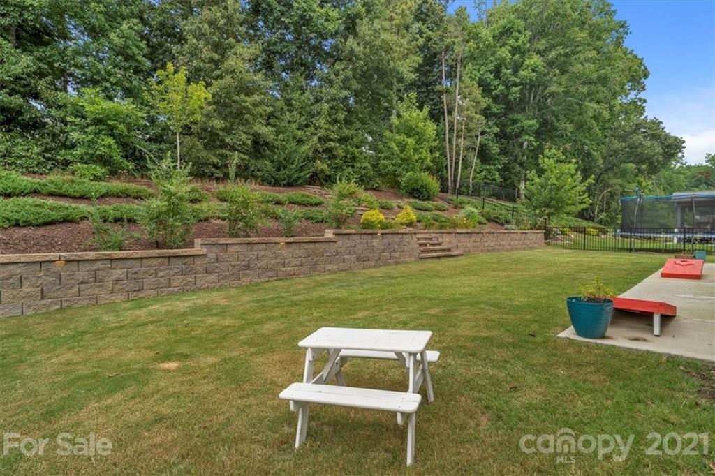 1526 Afton Way Fort Mill, SC 29708 - Photo 46 of 48 a garden with trees in the background