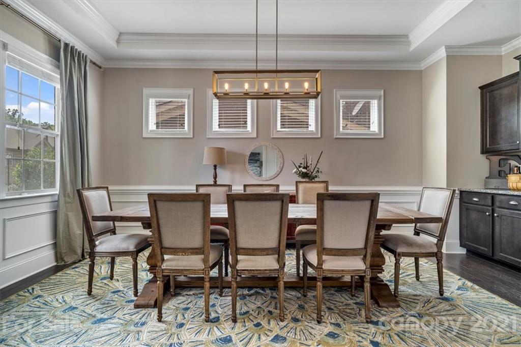 1526 Afton Way Fort Mill, SC 29708 - Photo 8 of 48 a view of a dining room with furniture a chandelier and wooden floor