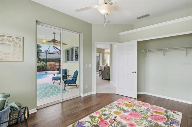 a bedroom with furniture and a wooden floor
