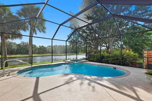 a view of a swimming pool with a yard