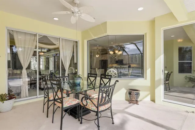 a view of a dining room with furniture window and outside view