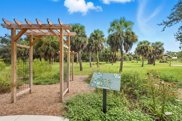 a view of a park with welcome board