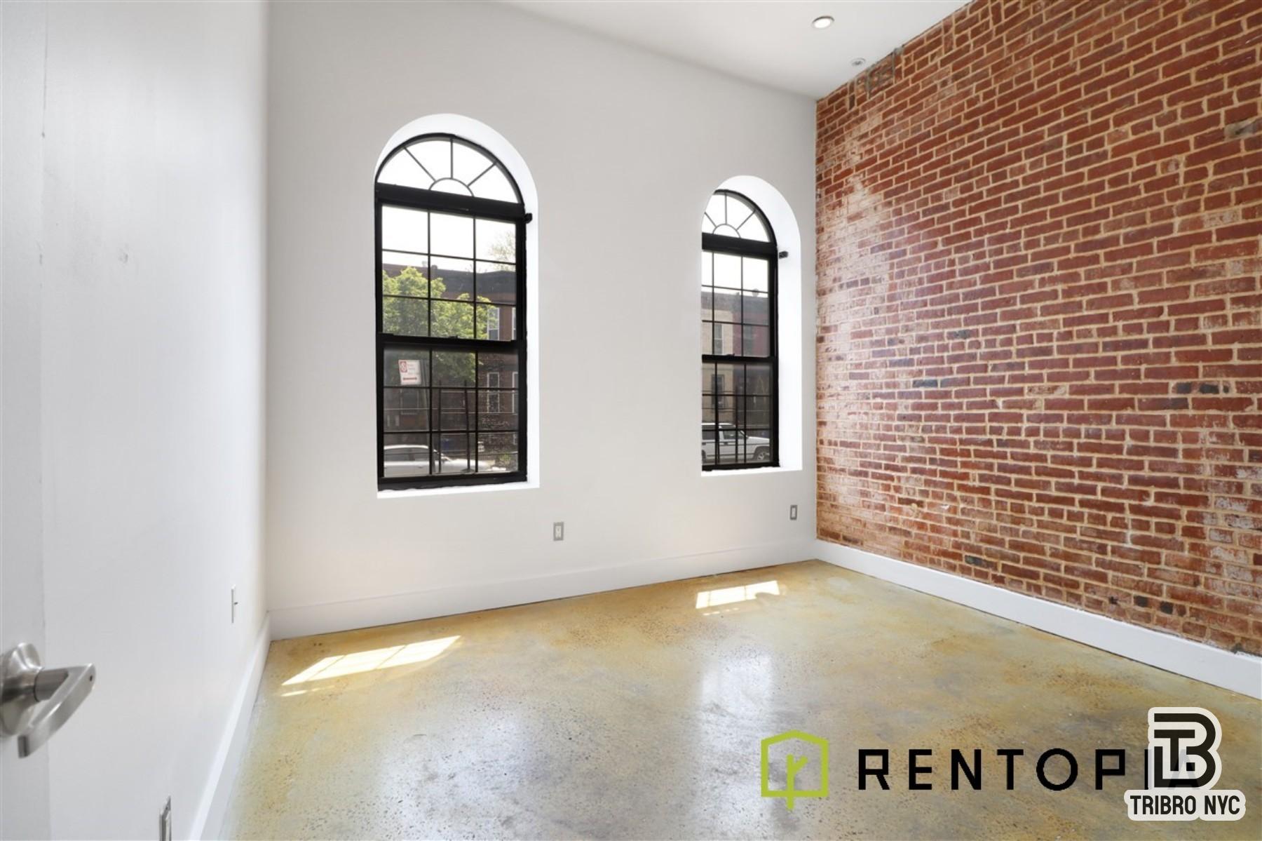 753 Lexington Avenue, Unit 1D Brooklyn, NY 11221 - Photo 2 of 8 a view of an empty room with window