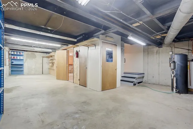 a view of empty room with wooden walls