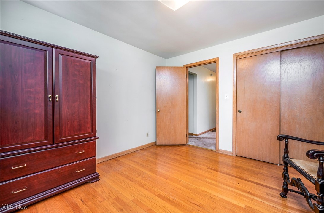 126 South Rhodes Avenue Niles, OH 44446 - Photo 14 of 23 Unfurnished bedroom with a closet and light wood-type flooring
