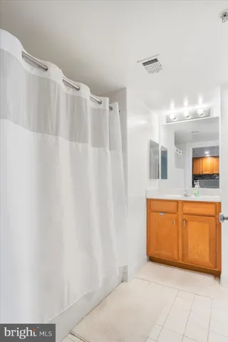a view of a bathroom with sink and mirror