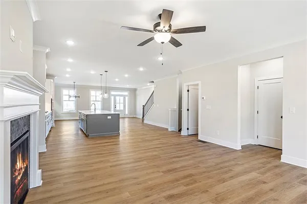 a view of kitchen and hall with wooden floor
