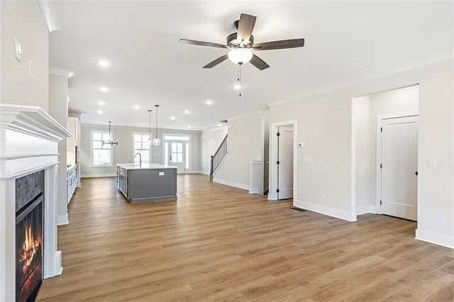 a view of kitchen and hall with wooden floor