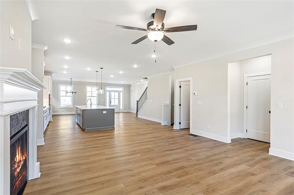152 Palm Street Holly Springs, GA 30115 - Photo 15 of 33 a view of kitchen and hall with wooden floor