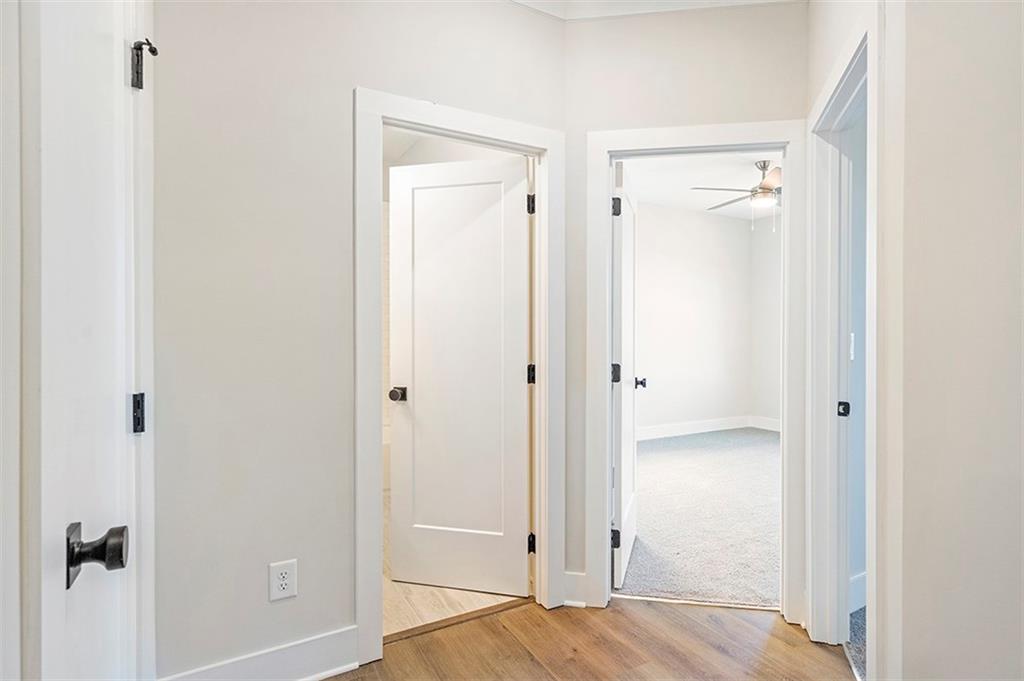 152 Palm Street Holly Springs, GA 30115 - Photo 24 of 33 a view of a bedroom with wooden floor