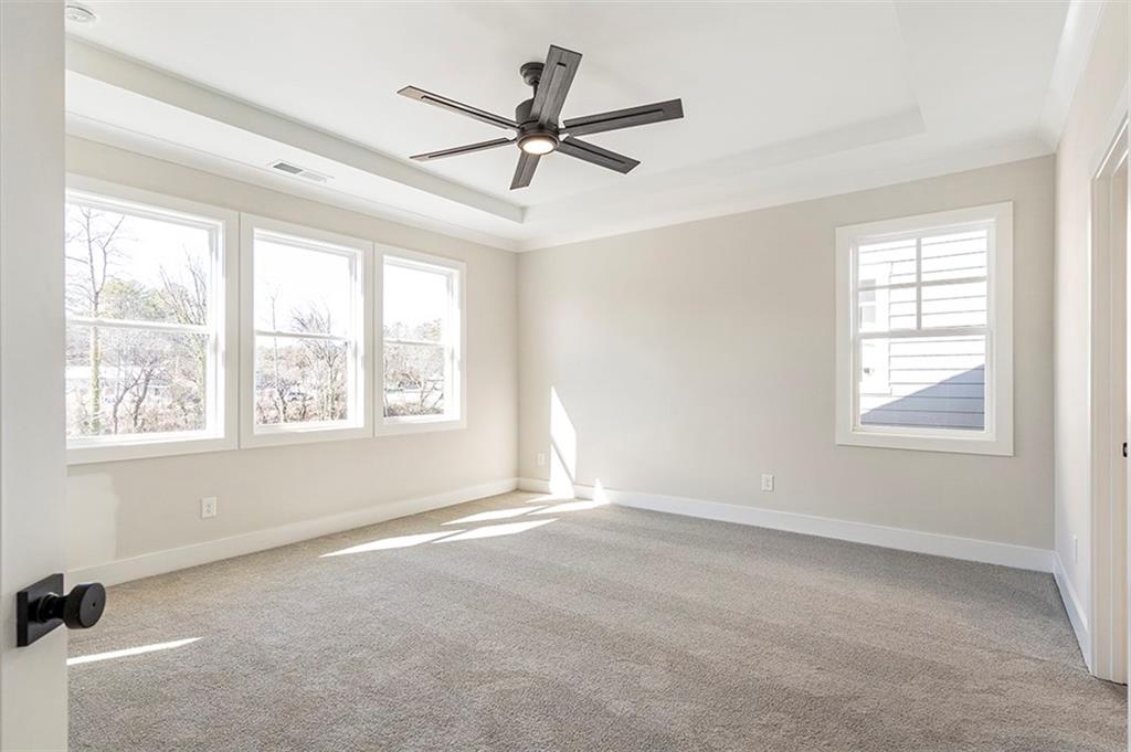 152 Palm Street Holly Springs, GA 30115 - Photo 28 of 33 a view of a livingroom with a ceiling fan and window