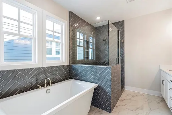 a bathroom with a bathtub and a sink