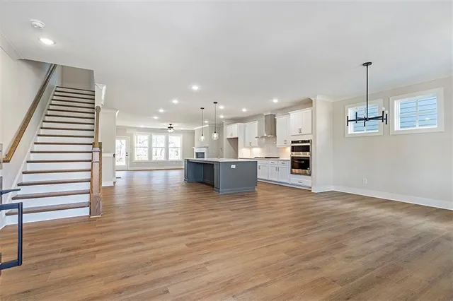 a view of a kitchen with a table and chairs