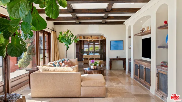 a living room with furniture and flat screen tv