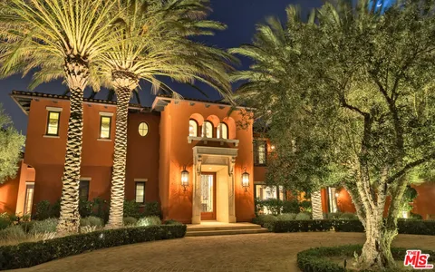 a view of swimming pool with a patio