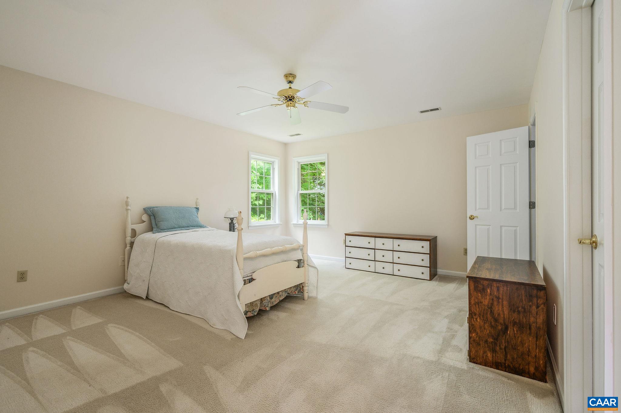 1330 Mosby Rch Charlottesville, VA 22901 - Photo 14 of 25 a spacious bedroom with a bed and a chandelier