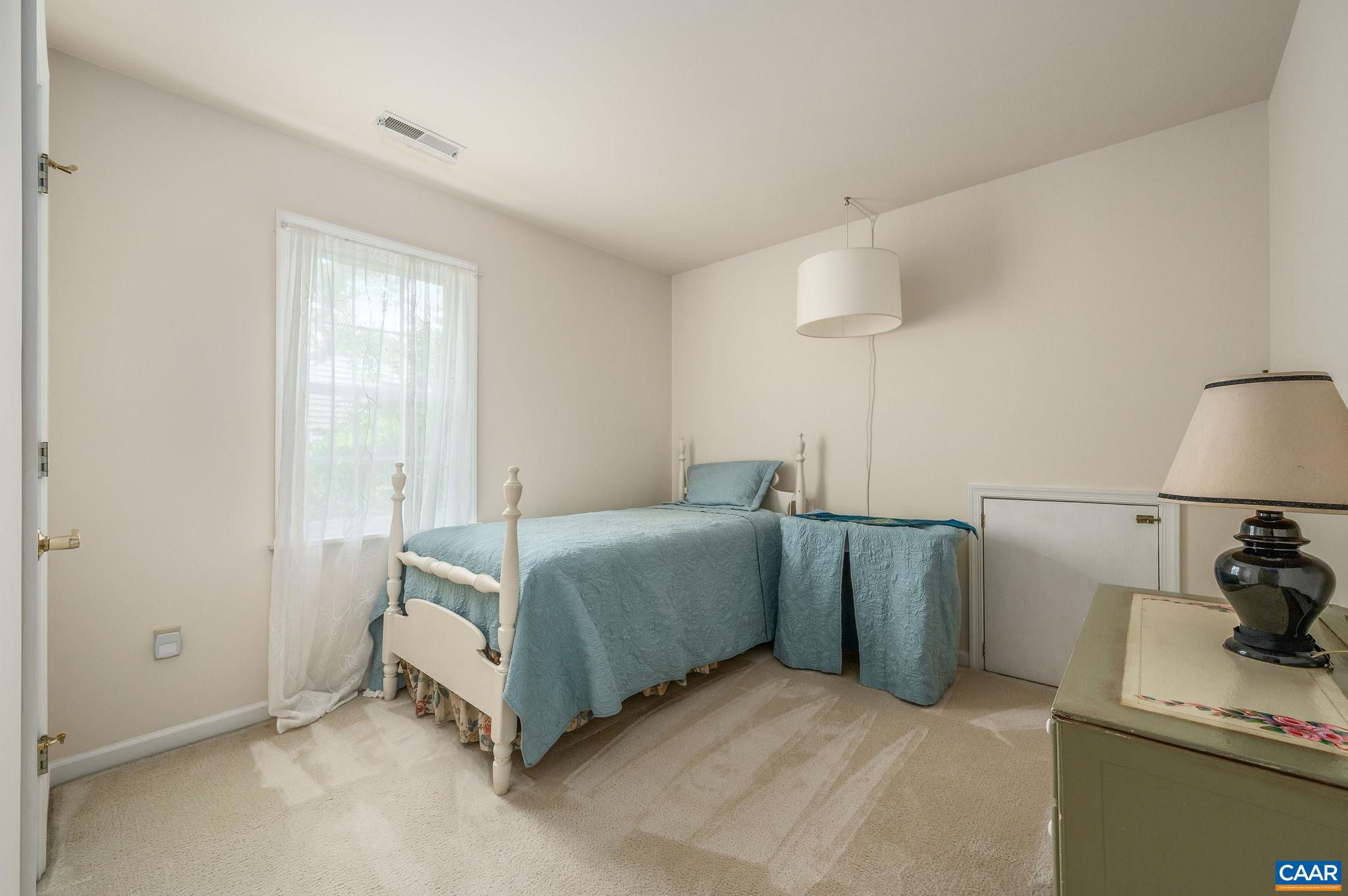 1330 Mosby Rch Charlottesville, VA 22901 - Photo 19 of 25 a bedroom with a bed and a lamp on the dresser