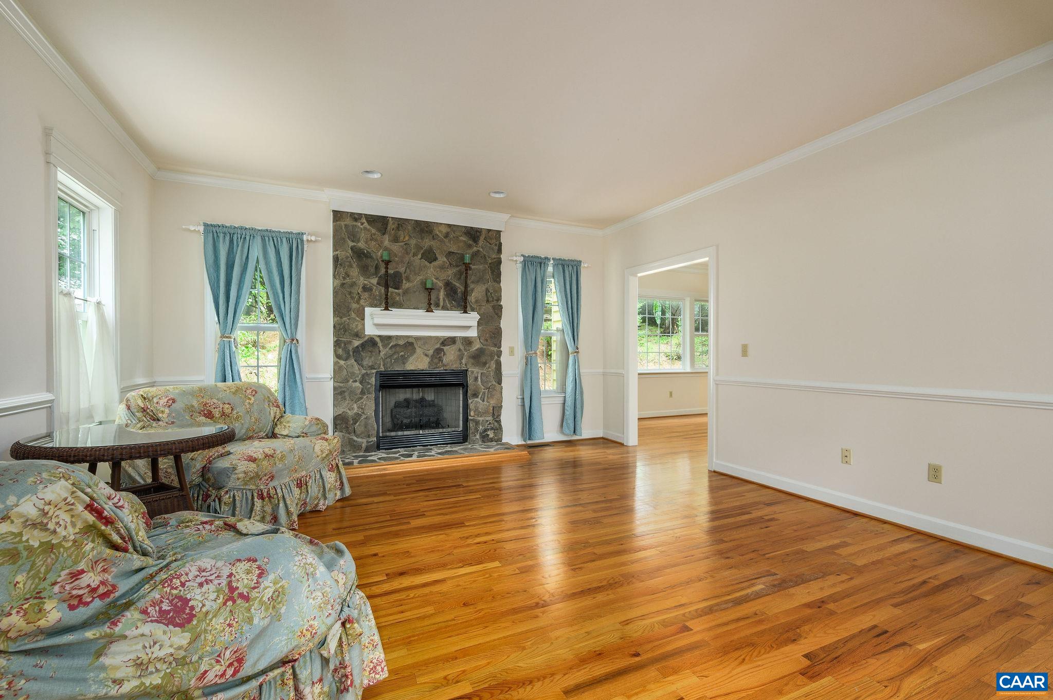 1330 Mosby Rch Charlottesville, VA 22901 - Photo 4 of 25 a living room with furniture and a fireplace