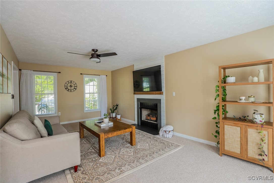 11400 Bailey Mountain Trail Midlothian, VA 23112 - Photo 12 of 41 a living room with furniture and a fireplace