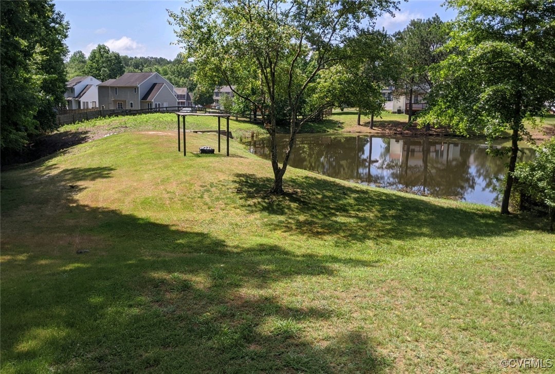 11400 Bailey Mountain Trail Midlothian, VA 23112 - Photo 14 of 41 a swimming pool with some trees in the background