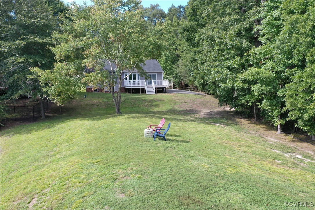 11400 Bailey Mountain Trail Midlothian, VA 23112 - Photo 18 of 41 a yellow and red house sitting in the middle of a yard